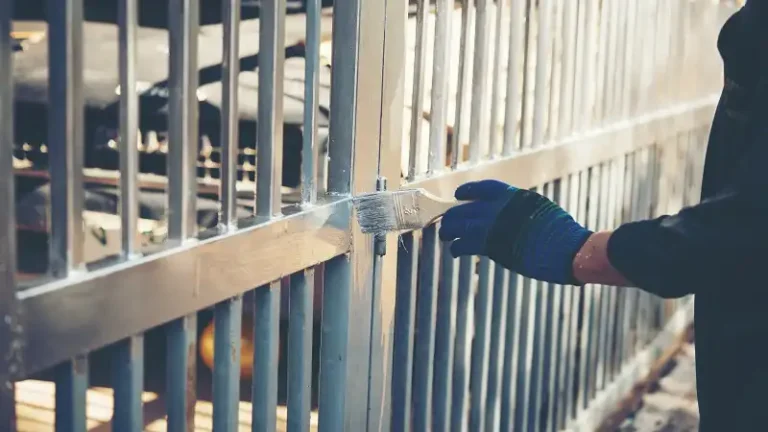 Why Painting Over Rust Destroys Your Iron Fence